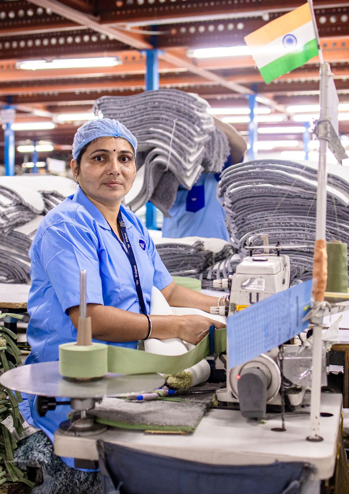 Worker at a sewing machine in an Indian textile factory